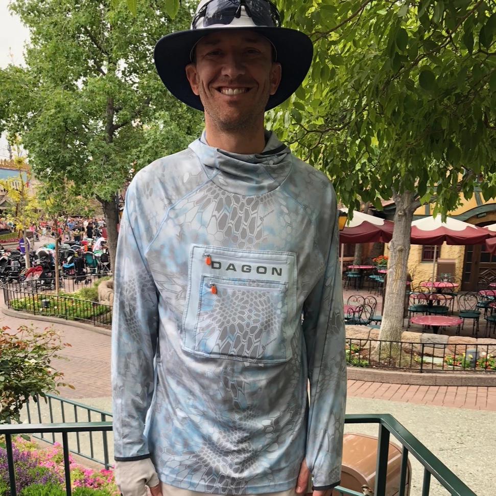 A smiling man wearing power technical hoodie