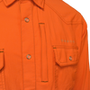 Close view of pockets and snap button on Orange hunting shirt