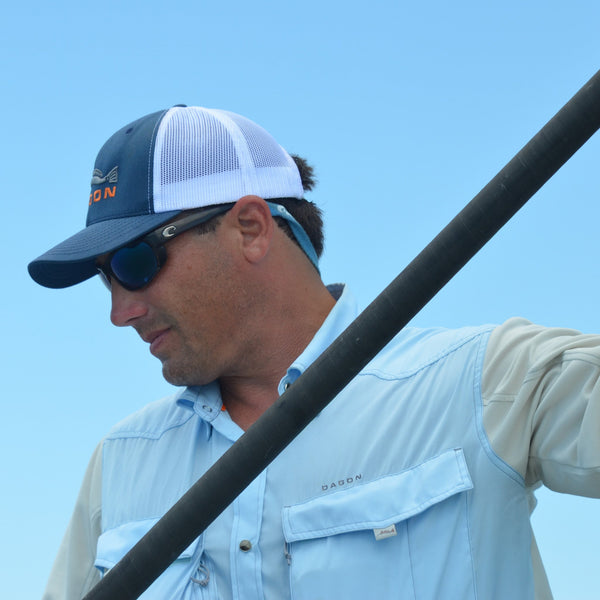 Man wearing dagon fishing hat and ballad blue fishing shirt