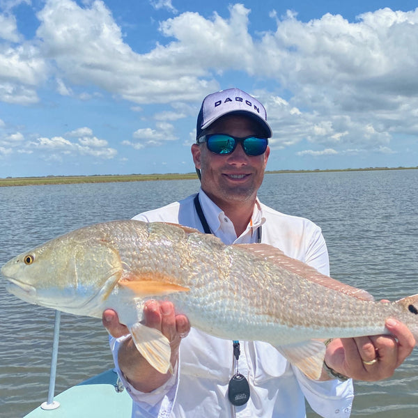 Angler wear dagon tarpon hat on fishing