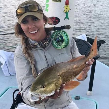 A Woman on fishing wearing Dagon Gray shirt
